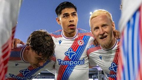 Dario Osorio in a Crystal Palace huddle