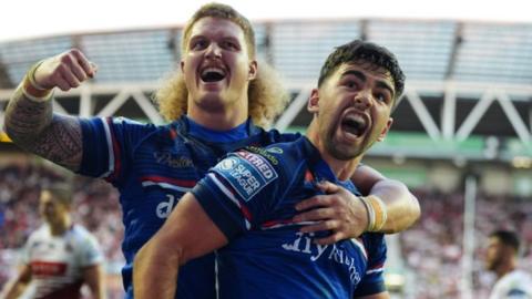 Jack Sinfield celebrates a try for Wakefield