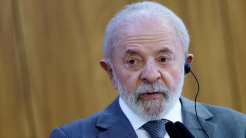 Brazil's President Luiz Inácio Lula da Silva speaks during a joint press statement  at Planalto Palace in Brasilia, Brazil July 9, 2025. He is wearing a blue suit and wearing an ear piece during a joint press statement with the Indonesian president. 