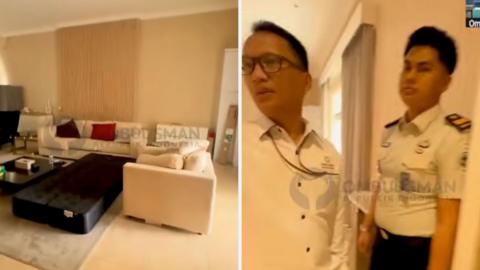 Composite image of a living room with a white couch and two Indonesian officials looking through a doorway