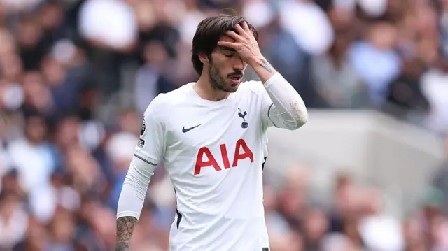 Sandro Tonali of Tottenham Hotspur reacts