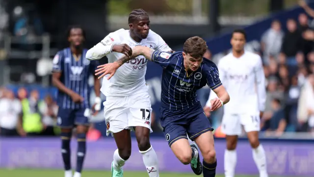 West Ham's Mo Kante and Millwall's Jenson Metcalfe battle for the ball during their London derby on Saturday