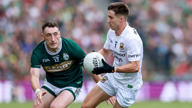 Mayo's Enda Hession is pursued by Kerry's Paudie Clifford