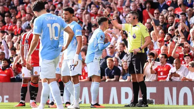 Phil Foden of Manchester City is sent off by match referee Michael Oliver during the Premier League match at Manchester United