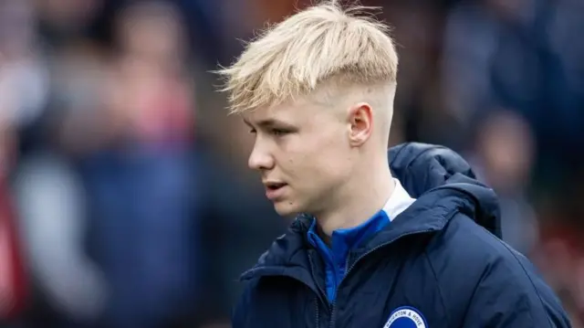 Joe Knight in Brighton & Hove Albion tracksuit