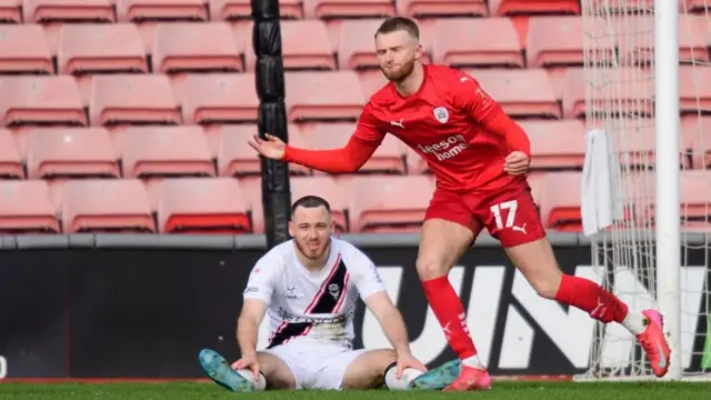 Georgie Gent celebrates after scoring for Barnsley against Lincoln in League One in March 2025