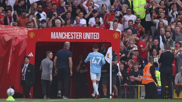 Phil Foden of Manchester City goes down the tunnel after he is sent off