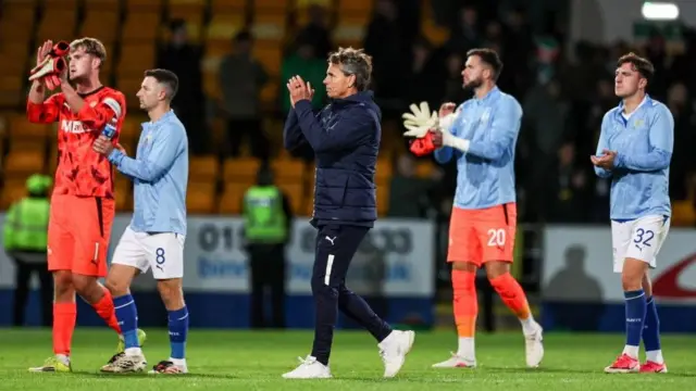 St Johnstone manager Simo Valakari and his players applaud fans