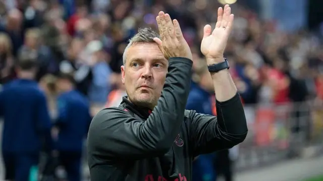 Michael Skubala applauds the fans ahead of Bristol City's game against his previous club, Lincoln City