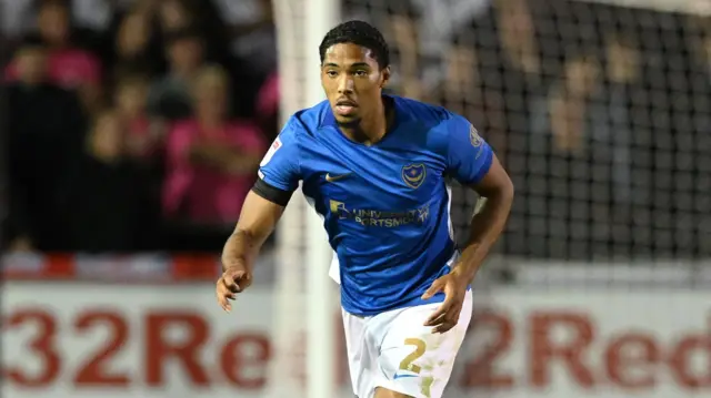 Benjamin Arthur looks straight ahead as he runs on the pitch during a game for Portsmouth this season