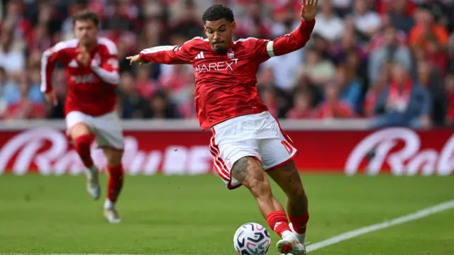Morgan Gibbs-White of Nottingham Forest keeps the ball in play during a Premier League match between Nottingham Forest and Tottenham