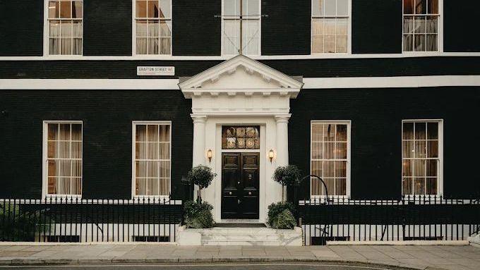 Maison Estelle is located within a large black and white Georgian townhouse, with planted trees flanking the porch and long windows overlooking Grafton Street