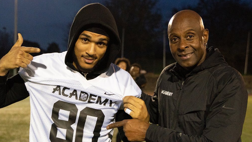 Seydou Traore and Jerry Rice pose for a picture at the NFL Academy in 2019
