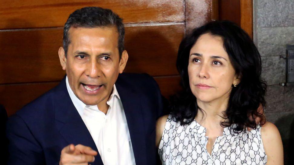 Ollanta Humala stands next to his wife Nadine Heredia 