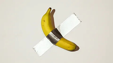 Close-up of banana with duct tape sticking it to a wall (Credit: Getty Images)