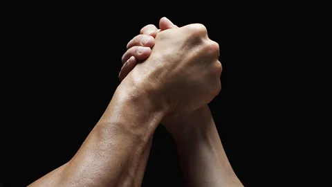 Two men arm wrestling (Credit: Getty Images)