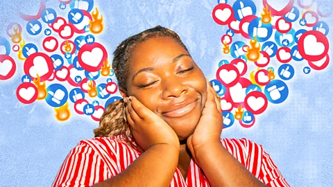 A woman smiling with emoji reactions floating around her head (Credit: BBC/ Serenity Strull/ Getty Images)