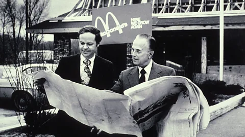 Alamy McDonald’s CEO Ray Kroc (right) replaced Meston’s original ultra-modern building with a more traditional, mansard-style roof (Credit: Alamy)
