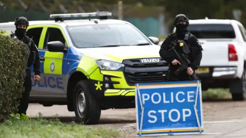 Reuters An armed police officer stands guards on a road outside the perimeter of the RAF Fairford airbase