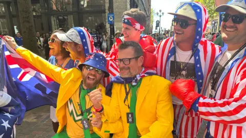 World Cup fans wearing green and gold and the American flag