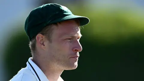 Worcestershire all-rounder Matthew Waite in his bottle-green Pears cap