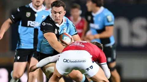 Taine Basham carries the ball into contact