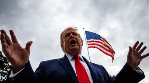 Donald Trump speaks to reporters at the White House, 26 September