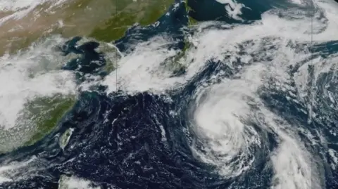 Satellite image of Typhoon Dujuan heading across the Pacific Ocean towards Japan