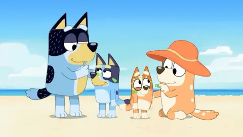 Bluey characters at a beach with Australian Indigenous face paint