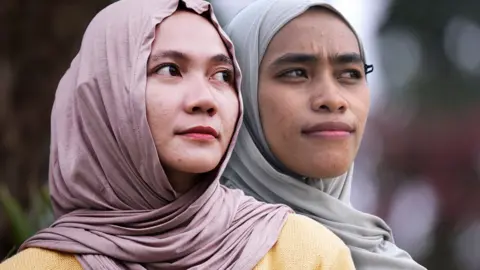 A composite image of two women in hijab looking straight ahead into the distance