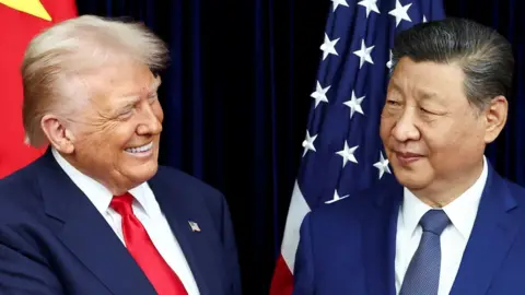 US President Donald Trump and Chinese leader Xi Jinping exchange smiles as they greet each other before a meeting. 