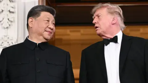 China's President Xi Jinping and US President Donald Trump pose on the North Portico steps of the White House ahead of a State Dinner in Washington, DC, on September 24, 2026.