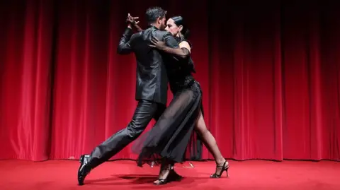 two Latino dancers