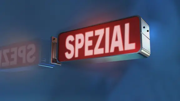 Eine leuchtende rote Schriftanzeige mit dem Wort "SPEZIAL" in Großbuchstaben, reflektiert an der Wand, vor einem unscharfen blauen Hintergrund.