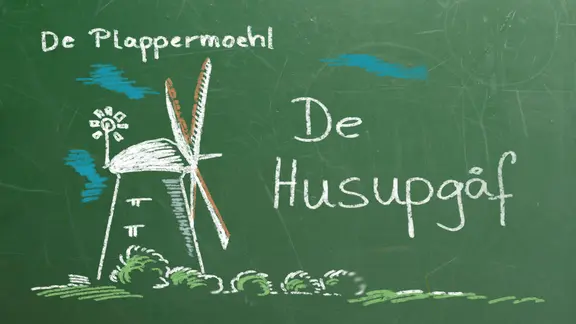 Eine Kreidefafel mit einer Mühle und der Aufschrift: De Plappermoehl - De Husupgåf