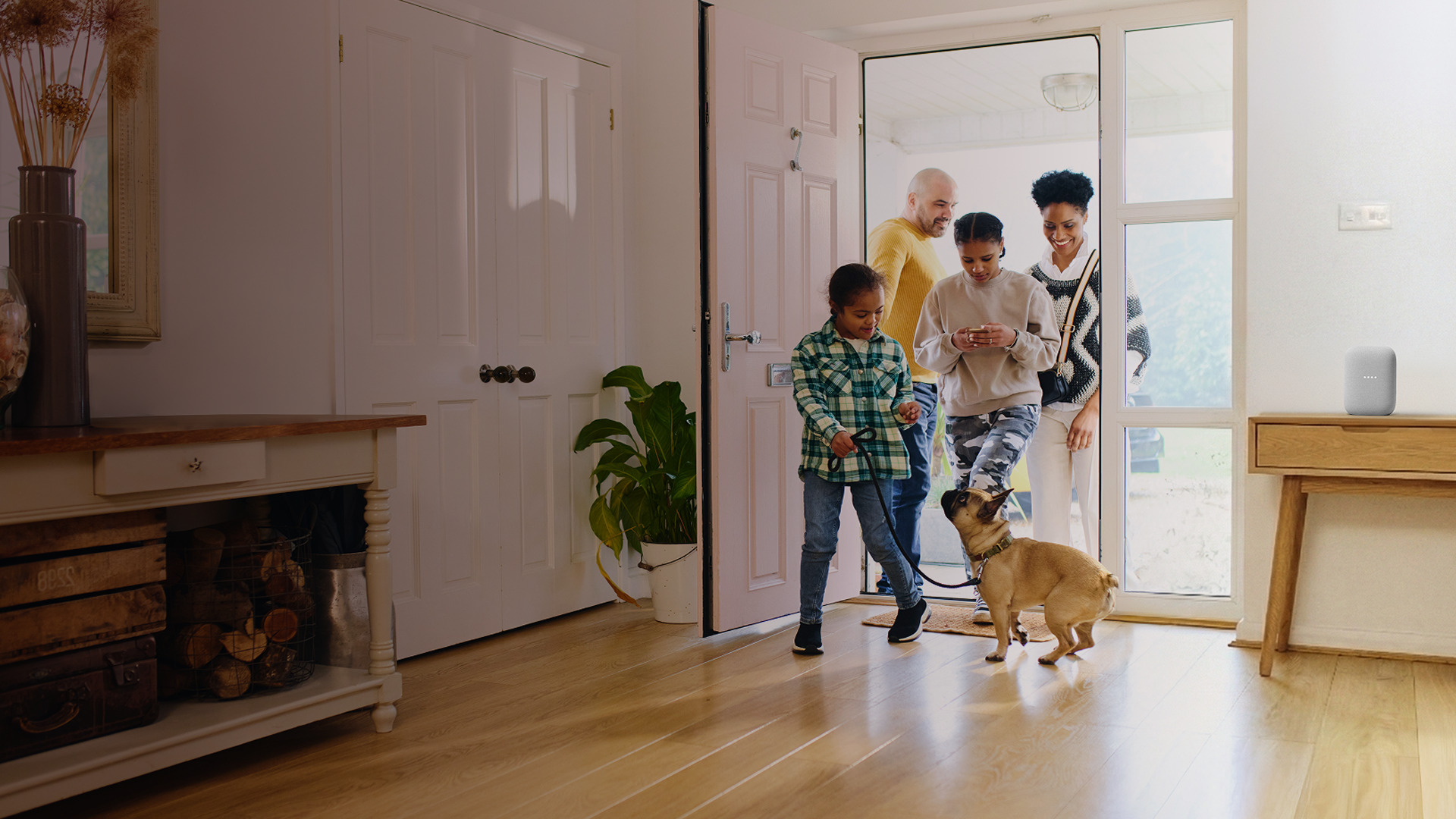 photo of a family walking into a home