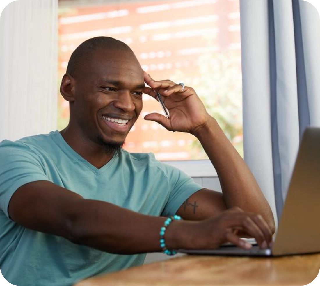 a middle aged bald man on his laptop using the scripted automations feature with google home
