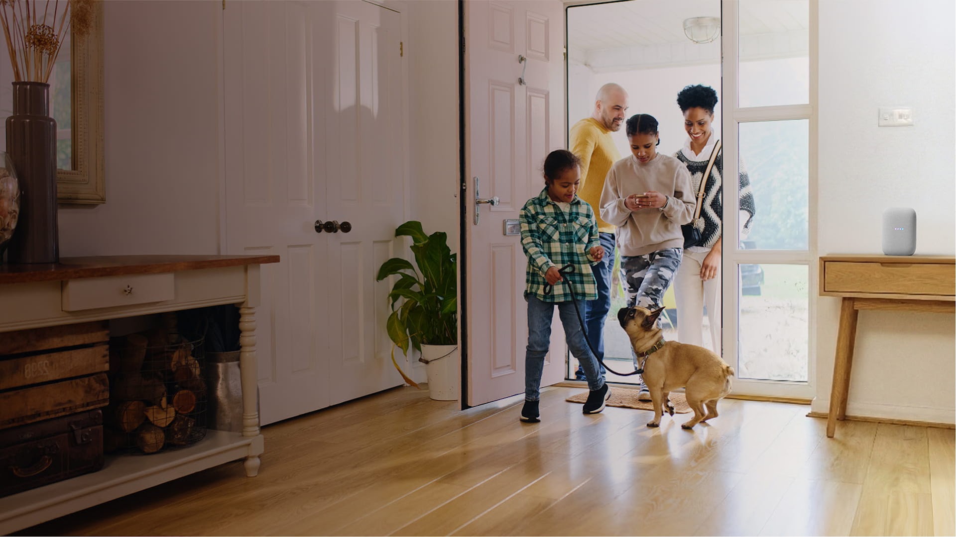 photo of a family walking into a home
