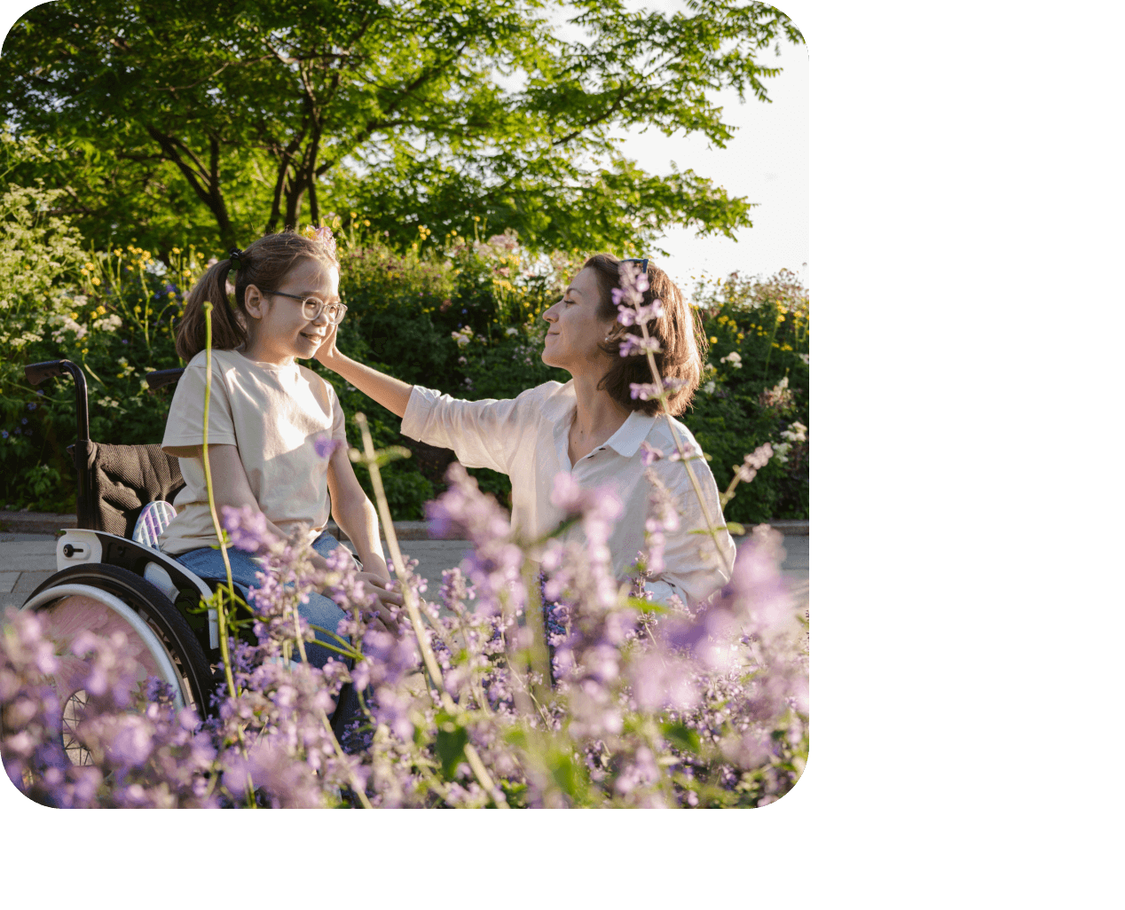 mother and daughter sitting in a field of purple flowers spending time together