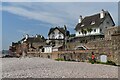 SY1287 : Thatched houses above the beach at Sidmouth by David Martin