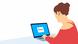 A woman uses a laptop. She wears a red top
