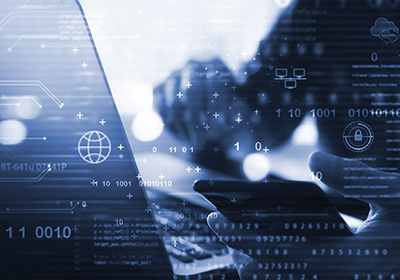Close up of a person working on a laptop in black and white with a technological graphic overlay
