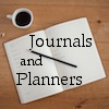 journalsandplanners: The text "journals and planners" superimposed on top of an open journal (Default)