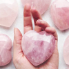 quartzwolf: A rose crystal heart in a hand (Heart Stone)
