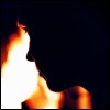 darkfire: A shadowed face in front of a fire (In Front of Fire)