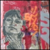 killer_quean: Black and white image of a woman's face, wheat-pasted onto a red and orange graffiti-covered wall. (SF)