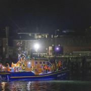 A group of people thought to be migrants are brought in to a marina in Gosport, by the RNLI following a small boat incident in the Channel. Picture date: Sunday October 4, 2026.