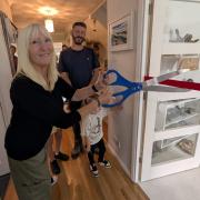 Fossil fanatic Maria Ferguson cutting the ribbon to officially open their mini home museum, Family Fossils, in Carisbrooke