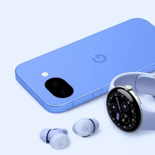 A violet-colored Pixel phone lays face-down next to a pair of Pixel Buds and a Google watch, both a lighter purple tint. A soft purple background brings together the monochromatic look.
