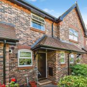 Front exterior of the brick-built terraced property with covered entrance